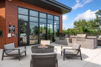 Poolside-lounge with bbq-grills and tvs